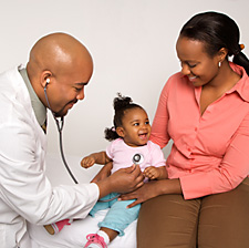 Doctor examining baby