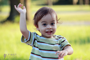 Young child playing in the grass