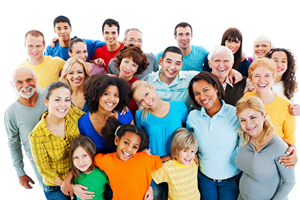 Portrait of a large group of a mixed age people smiling and embracing together.