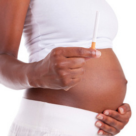 Pregnant woman holding a cigarette