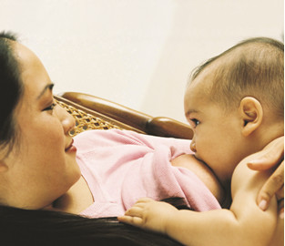 woman breastfeeding infant