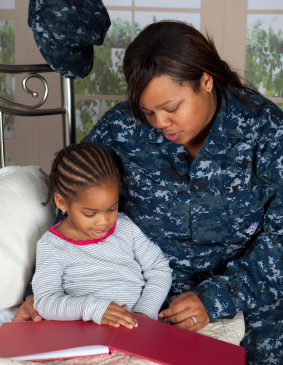 mother reading bedtime story to daugher