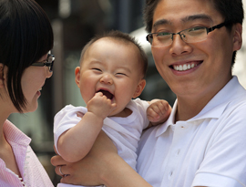 Father holding small child