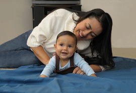 Mother and baby enjoying tummy time together.