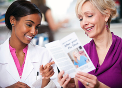 Two women looking at a medical brochure