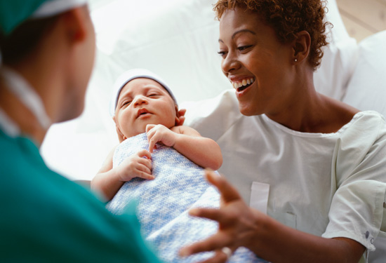 Stock image of newborn and mom in hospital