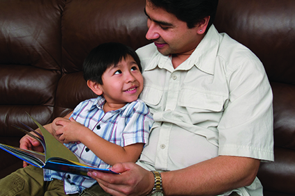 Dad reading with son